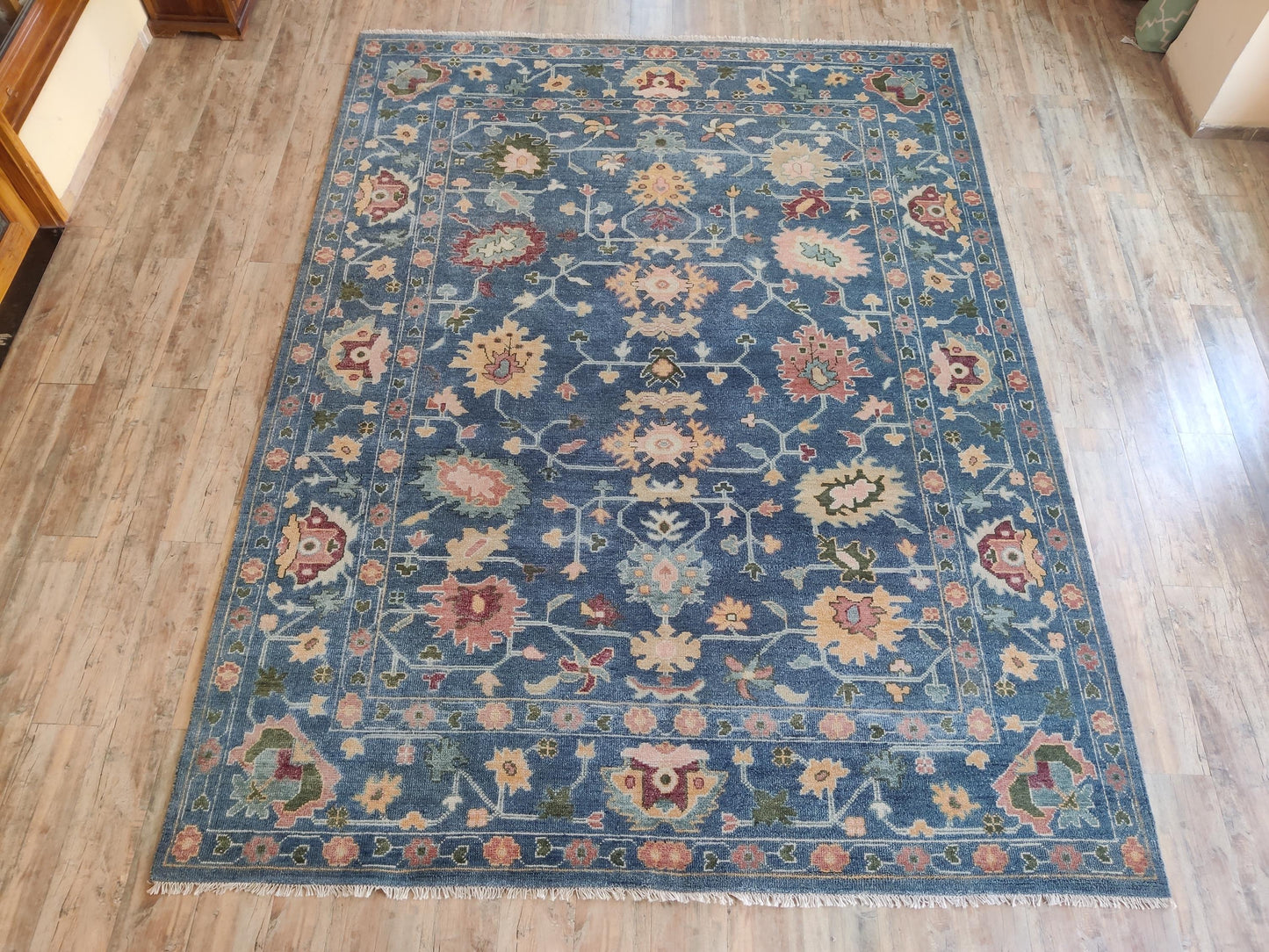 Indigo Blossom Hand-Knotted Oushak Carpet featuring Symmetrical Persian Botanical Motifs