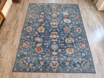 Indigo Blossom Hand-Knotted Oushak Carpet featuring Symmetrical Persian Botanical Motifs