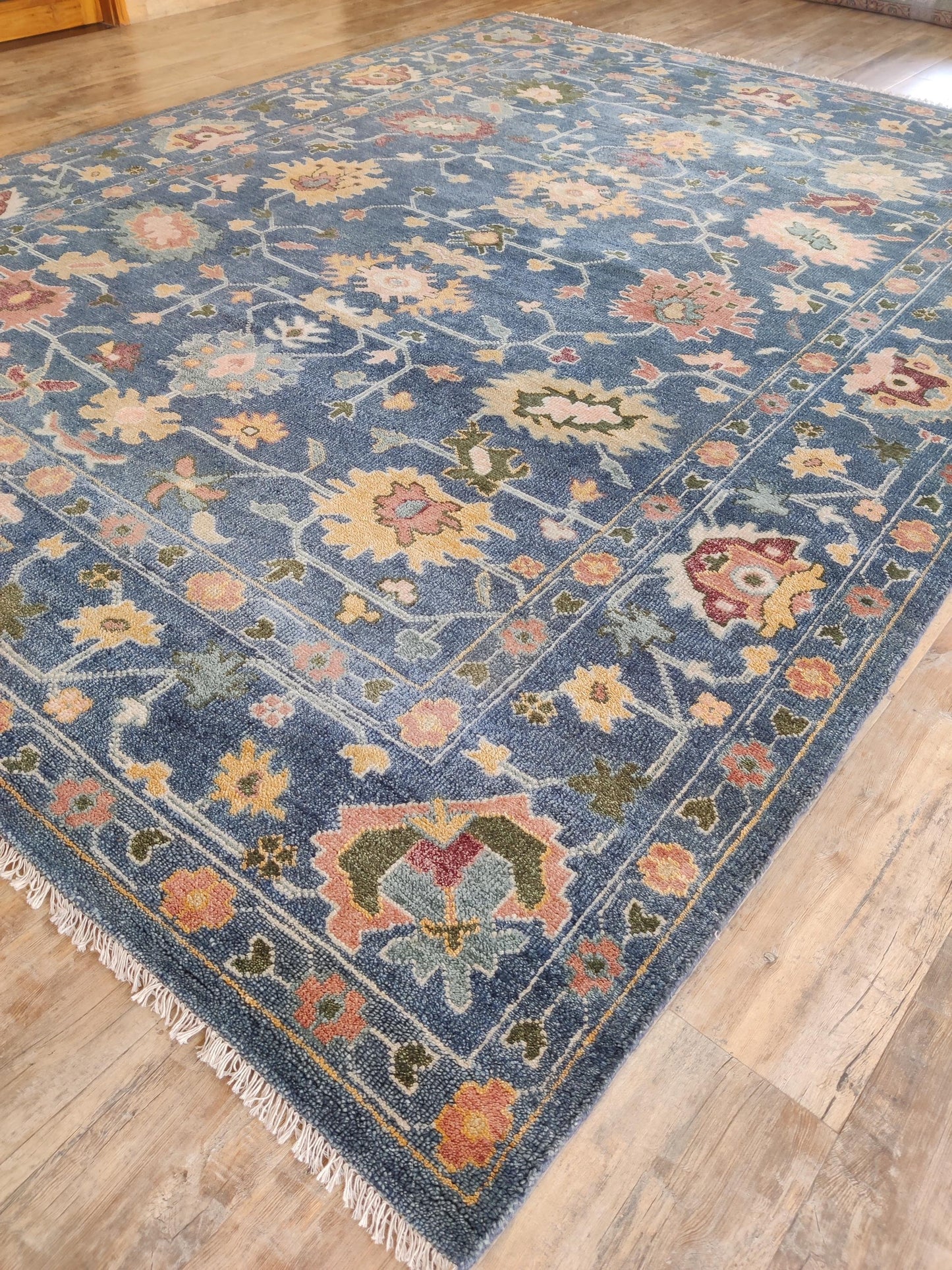 Indigo Blossom Hand-Knotted Oushak Carpet featuring Symmetrical Persian Botanical Motifs