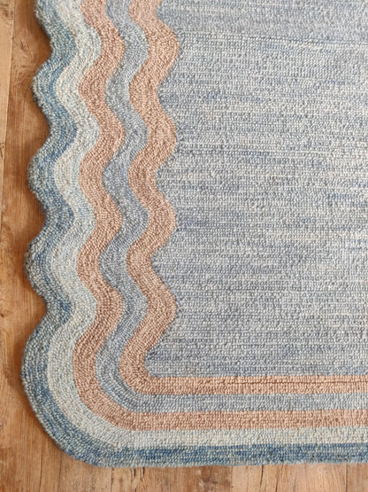 Muted Azure Blue with Scalloped Wavy Border rug