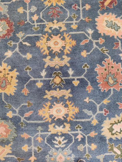 Indigo Blossom Hand-Knotted Oushak Carpet featuring Symmetrical Persian Botanical Motifs
