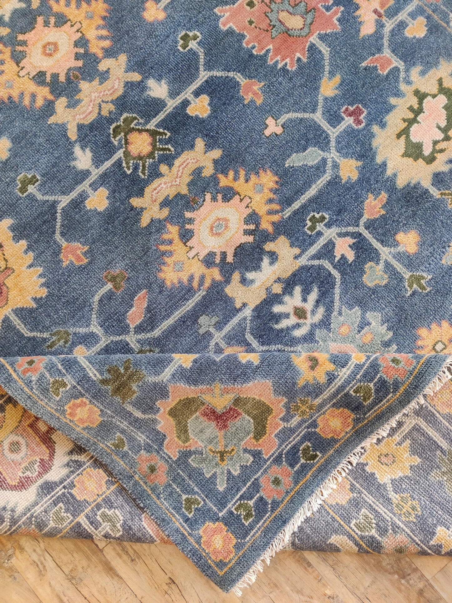 Indigo Blossom Hand-Knotted Oushak Carpet featuring Symmetrical Persian Botanical Motifs