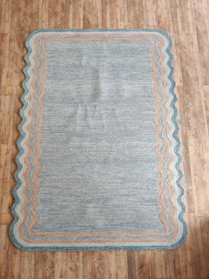 Muted Azure Blue with Scalloped Wavy Border rug